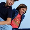 Maglietta elastica a maglia per bambina colore fragola