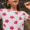 Maglietta in maglia per bambina di colore bianco con stampa floreale.
