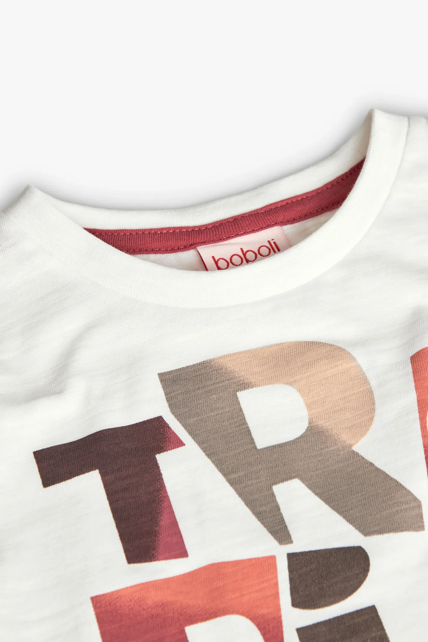 Maglietta lavorata a maglia per bambino in bianco con stampa.