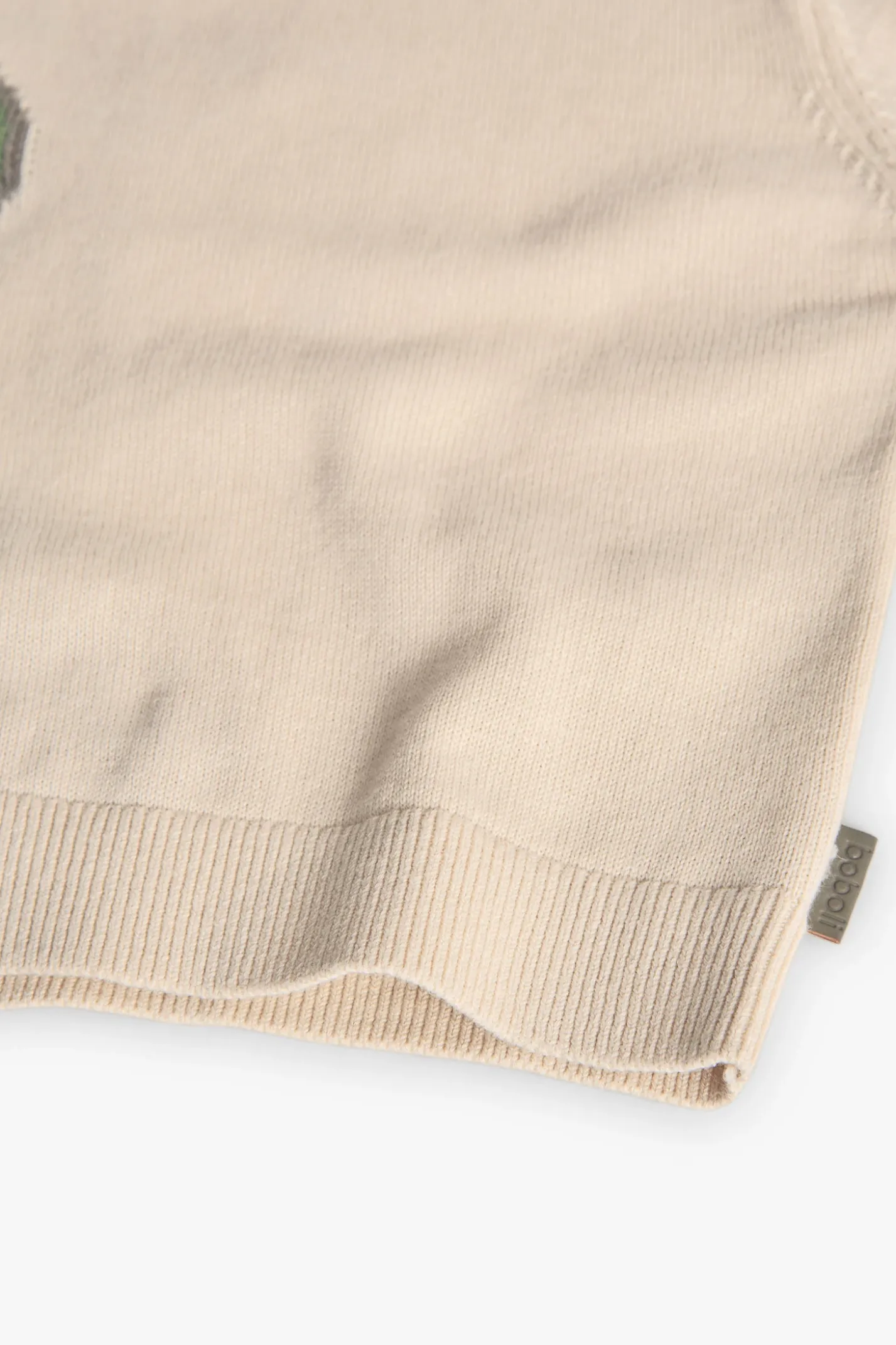 Maglioncino lavorato a maglia per bebè maschio di colore beige con motivo di dinosauro
