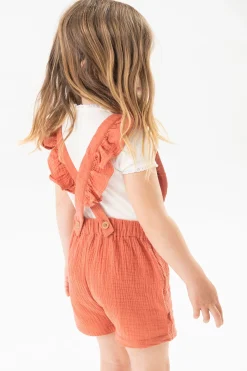 Pagliaccetto a maglia per bambina in colore arancione.