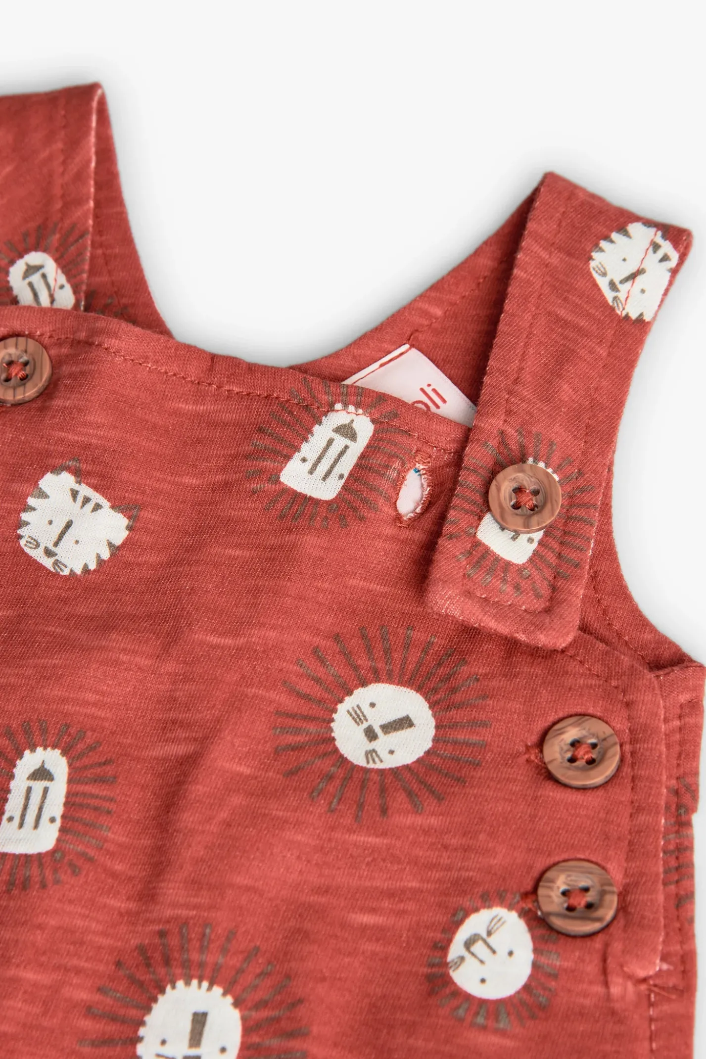 Pagliaccetto a maglia per neonato in colore rosso con stampa