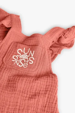 Pagliaccetto a maglia per bambina in colore arancione.