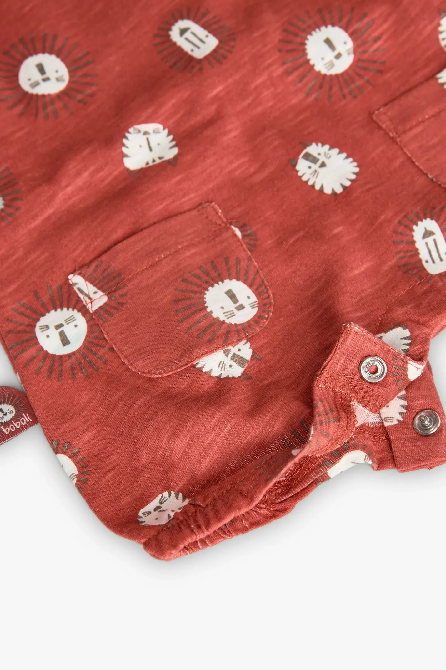 Pagliaccetto a maglia per neonato in colore rosso con stampa