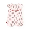 Pagliaccetto in maglia per neonata di colore bianco con motivo di fiori rossi.