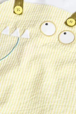 Pagliaccetto in popeline per neonato a righe di colore giallo.