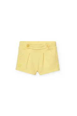 Pantaloncini in maglia per neonata in colore giallo