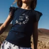 Pantaloncini in maglia per bambina con stampa floreale in bianco e blu