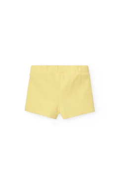Pantaloncini in maglia per neonata in colore giallo