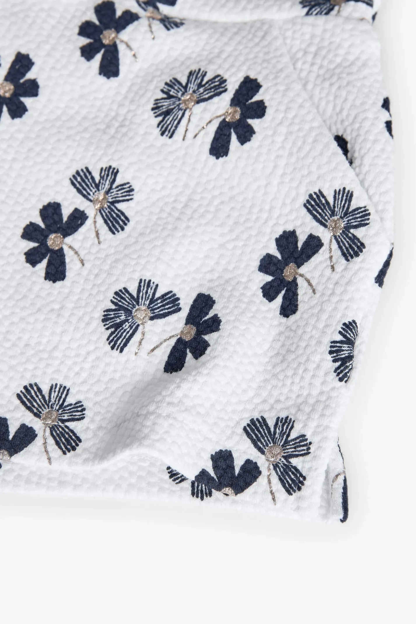Pantaloncini in maglia per bambina con stampa floreale in bianco e blu