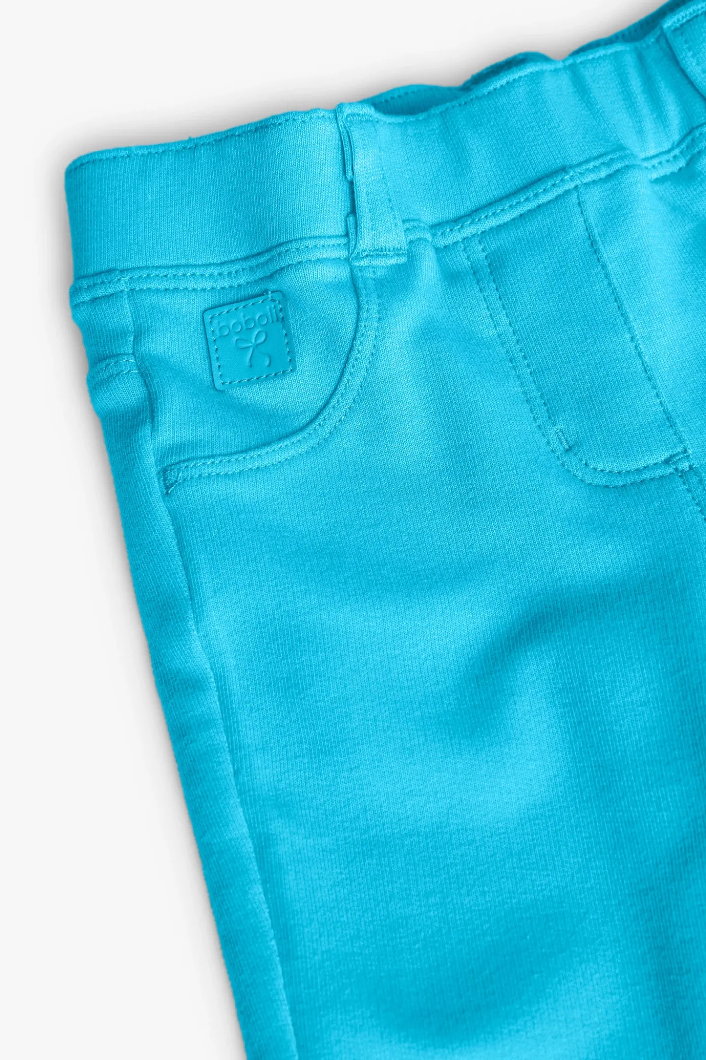 Pantalone di felpa per bambina in colore blu.