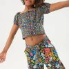 Pantalone in maglia elastica per bambina con stampa floreale