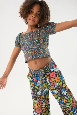 Pantalone in maglia elastica per bambina con stampa floreale