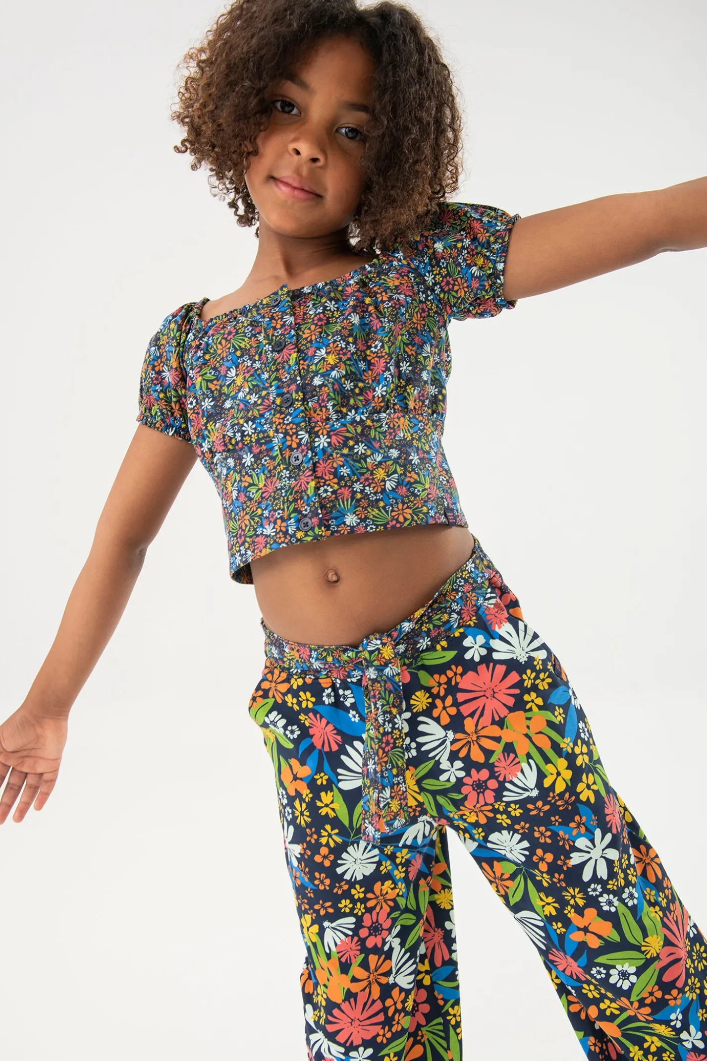 Pantalone in maglia elastica per bambina con stampa floreale