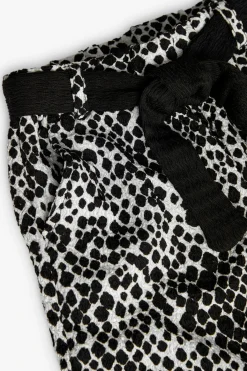 Pantaloni di maglia per bambina con stampa in bianco e nero.
