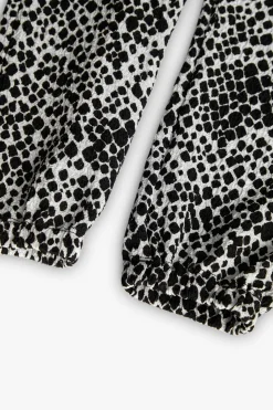 Pantaloni di maglia per bambina con stampa in bianco e nero.