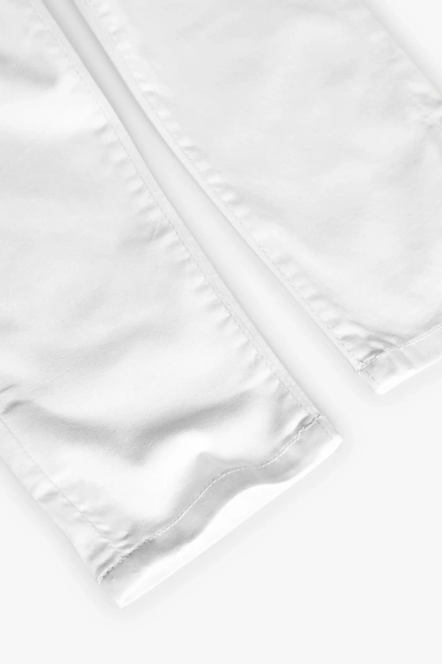 Pantaloni in raso per bambino di colore bianco