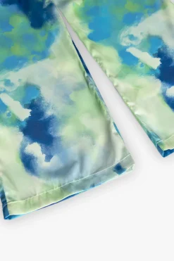 Pantaloni larghi in raso per bambina con stampa nei colori blu e verde
