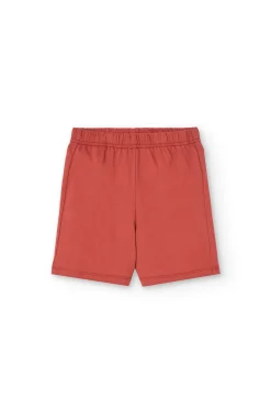 Pigiama corto in maglia per bambino di colore arancione
