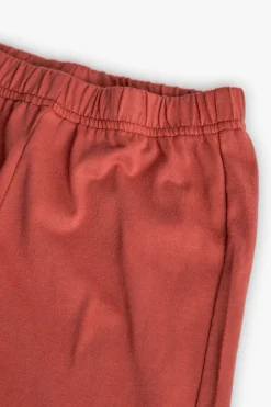 Pigiama corto in maglia per bambino di colore arancione