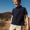 Polo in piqué per bambino con stampa in blu marino