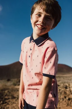 Polo piqué per bambino con stampa in colore rosa