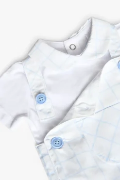 Set da neonato lavorato a maglia in colore bianco con stampa a quadri.
