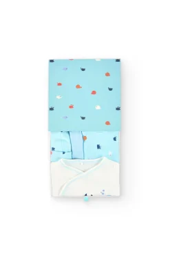 Set di maglieria per neonato in colore bianco.