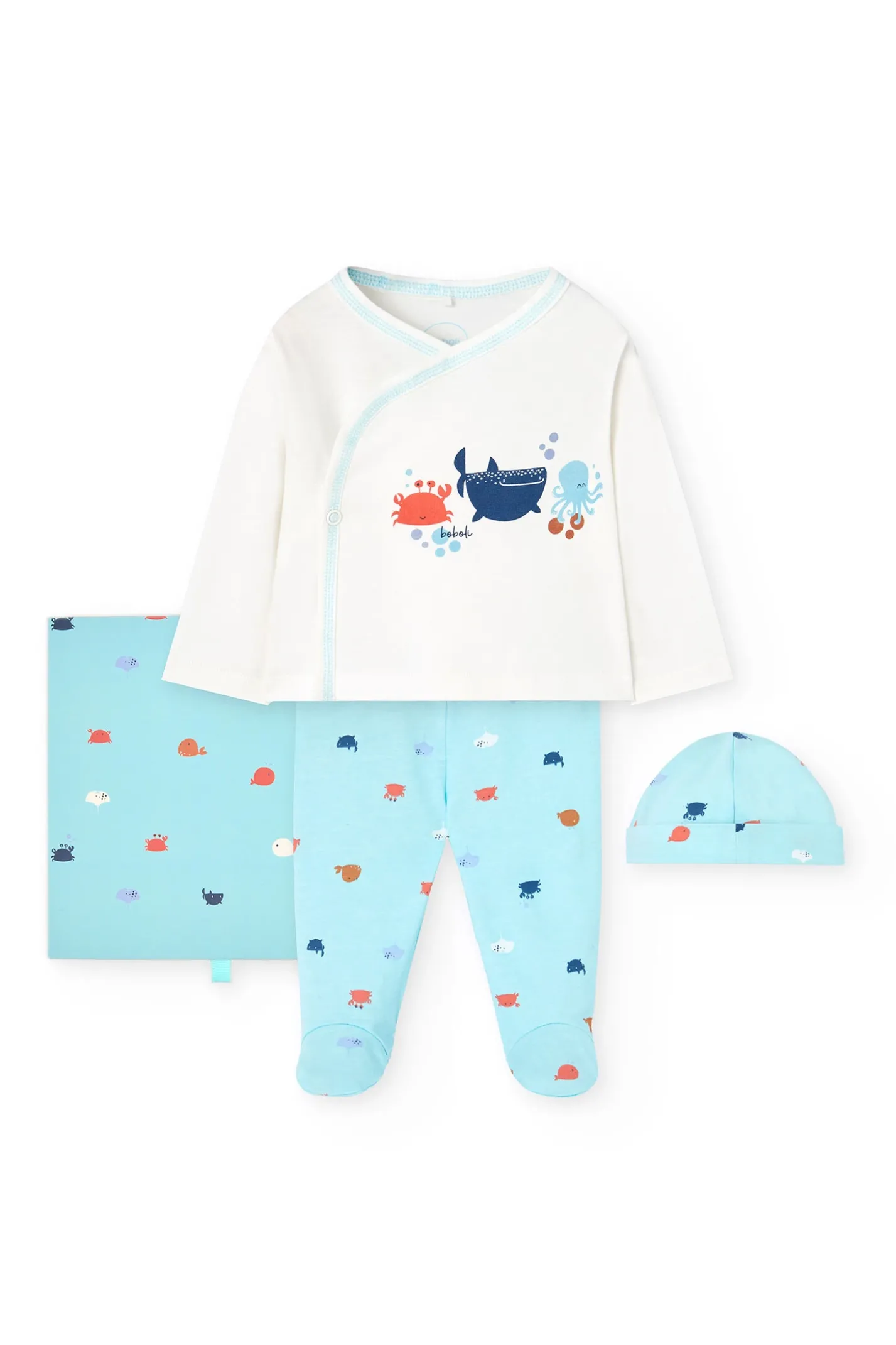 Set di maglieria per neonato in colore bianco.