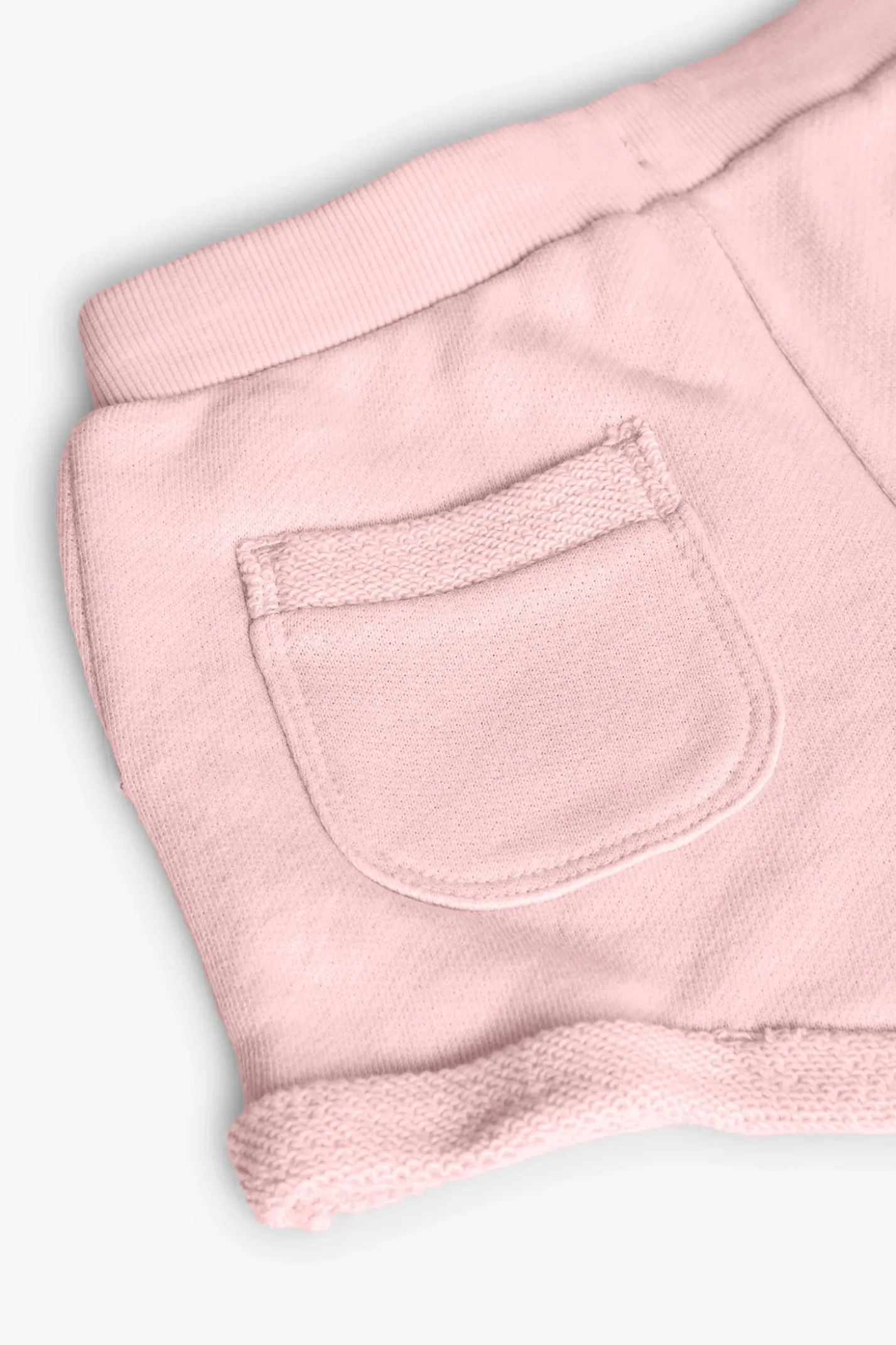 Short in felpa per bambina di colore rosa.