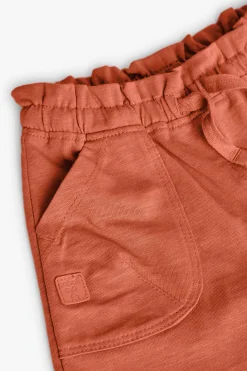 Short in maglia per bambina in colore arancione