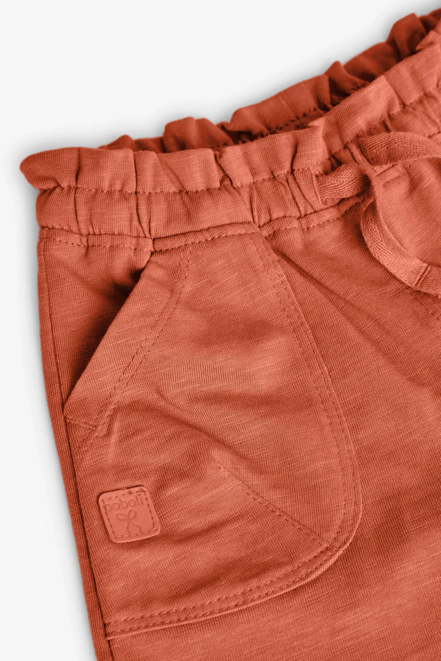 Short in maglia per bambina in colore arancione