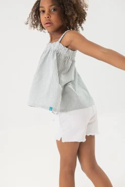 Short in tessuto di cotone elasticizzato per bambina di colore bianco.