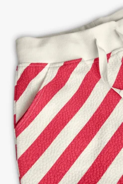 Short lavorati a maglia con motivo in rilievo per bambina in rosso e bianco.