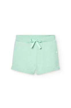 Shorts in felpa per bambina di colore verde.