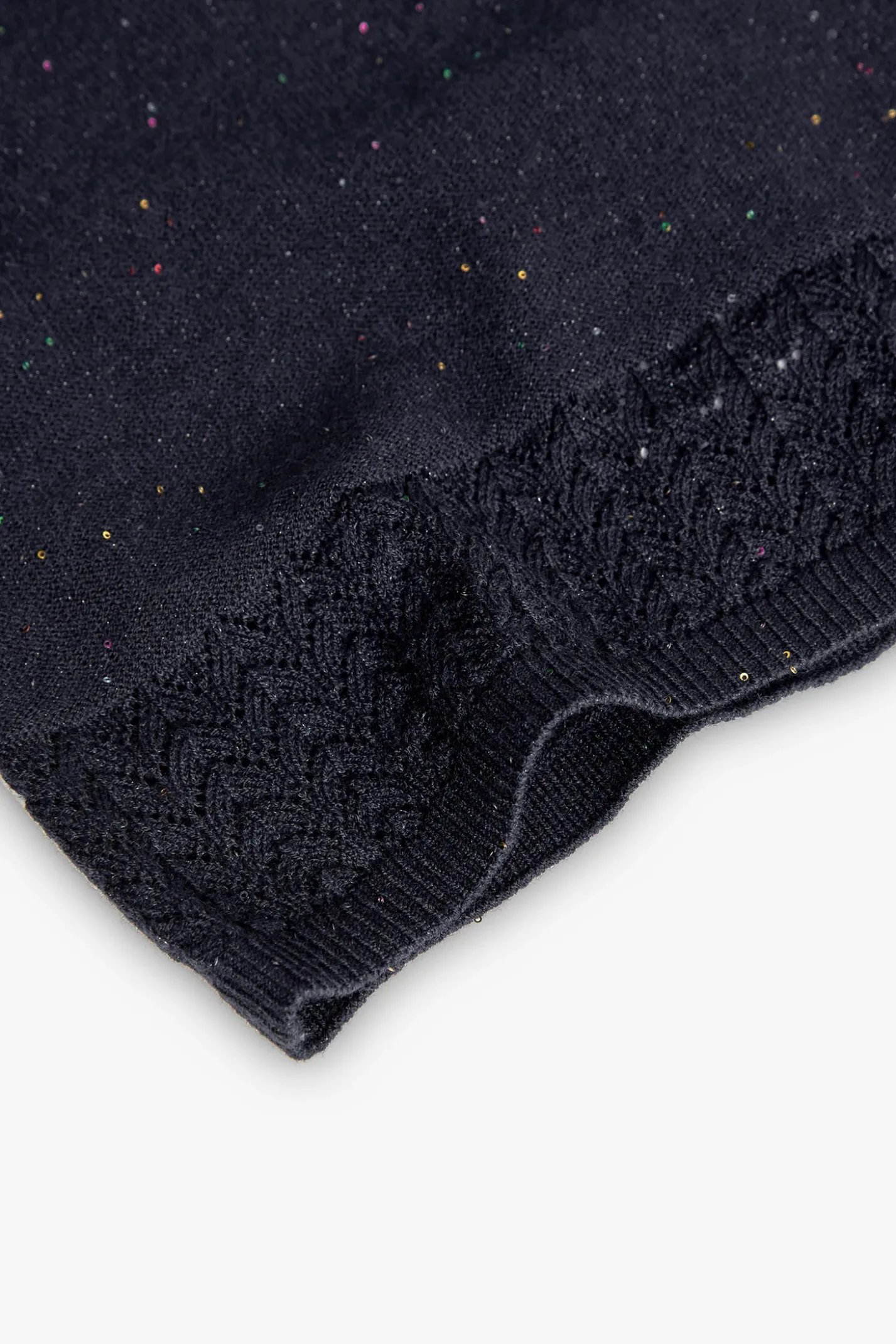 Top a maglia per bambina in colore blu marino.