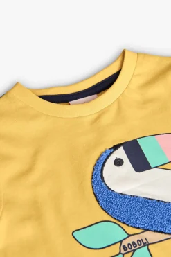 T-shirt in maglia per neonato in giallo con stampa di tucano