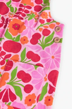 Tuta in maglia per bambina con design floreale in rosa e verde.