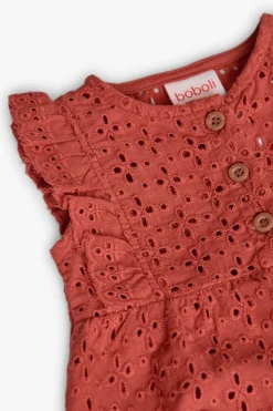 Tutina a maglia per bambina in colore arancione ricamata