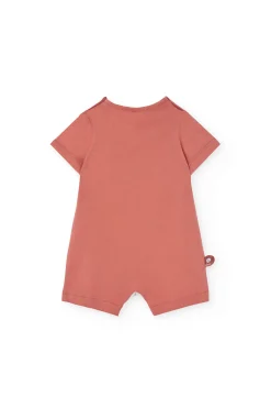 Tutina corta in maglia per bebé di colore arancione.