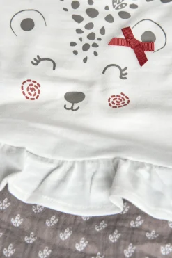 Tutina in maglia per neonata in bianco combinato