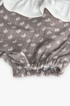 Tutina in maglia per neonata in bianco combinato