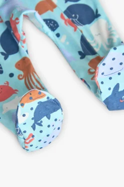 Tutina in maglia per neonato di colore blu con stampa di motivi marini.