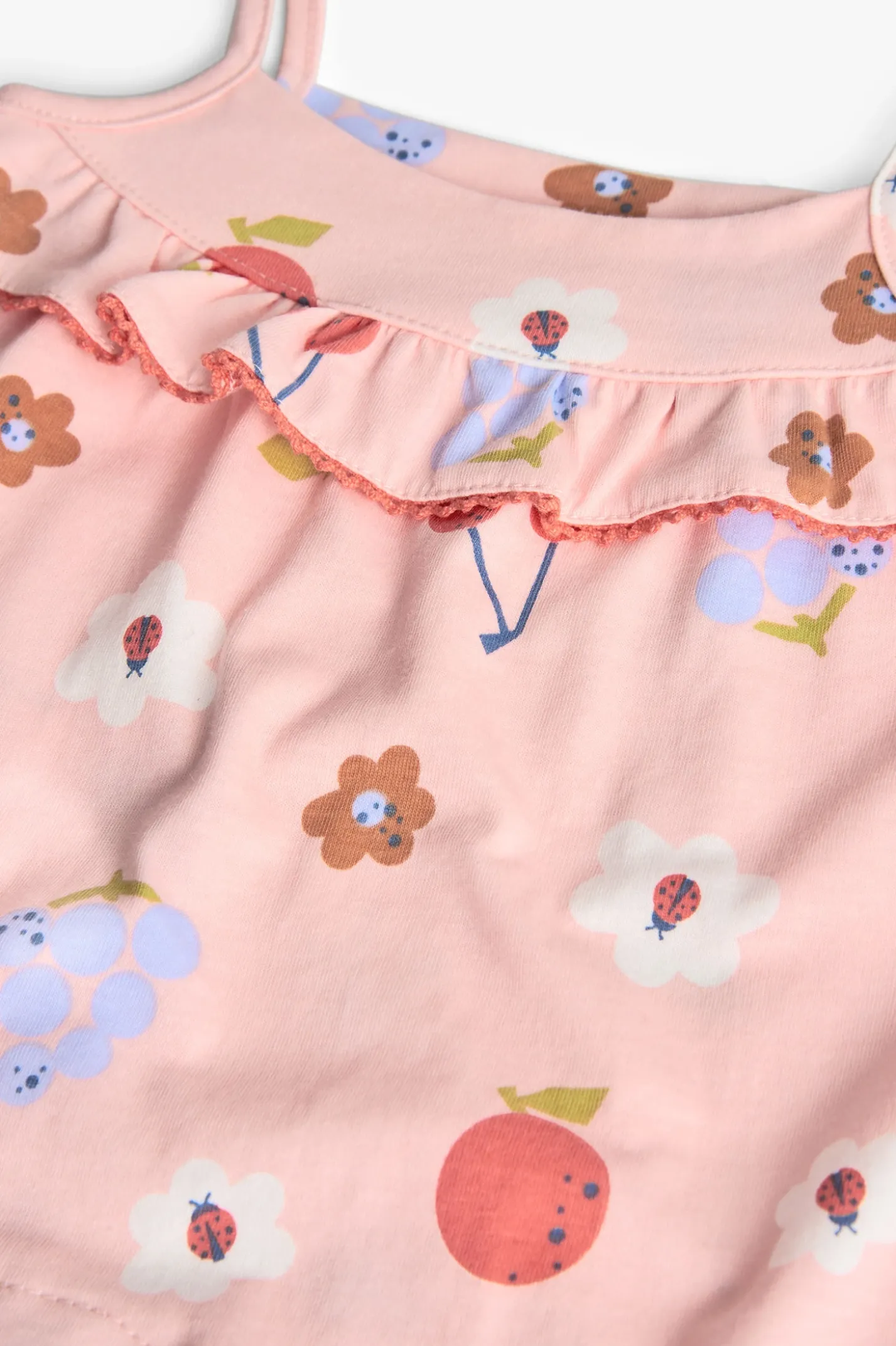 Tutina in maglia per neonata con stampa floreale in rosa.