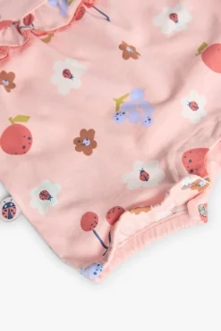 Tutina in maglia per neonata con stampa floreale in rosa.