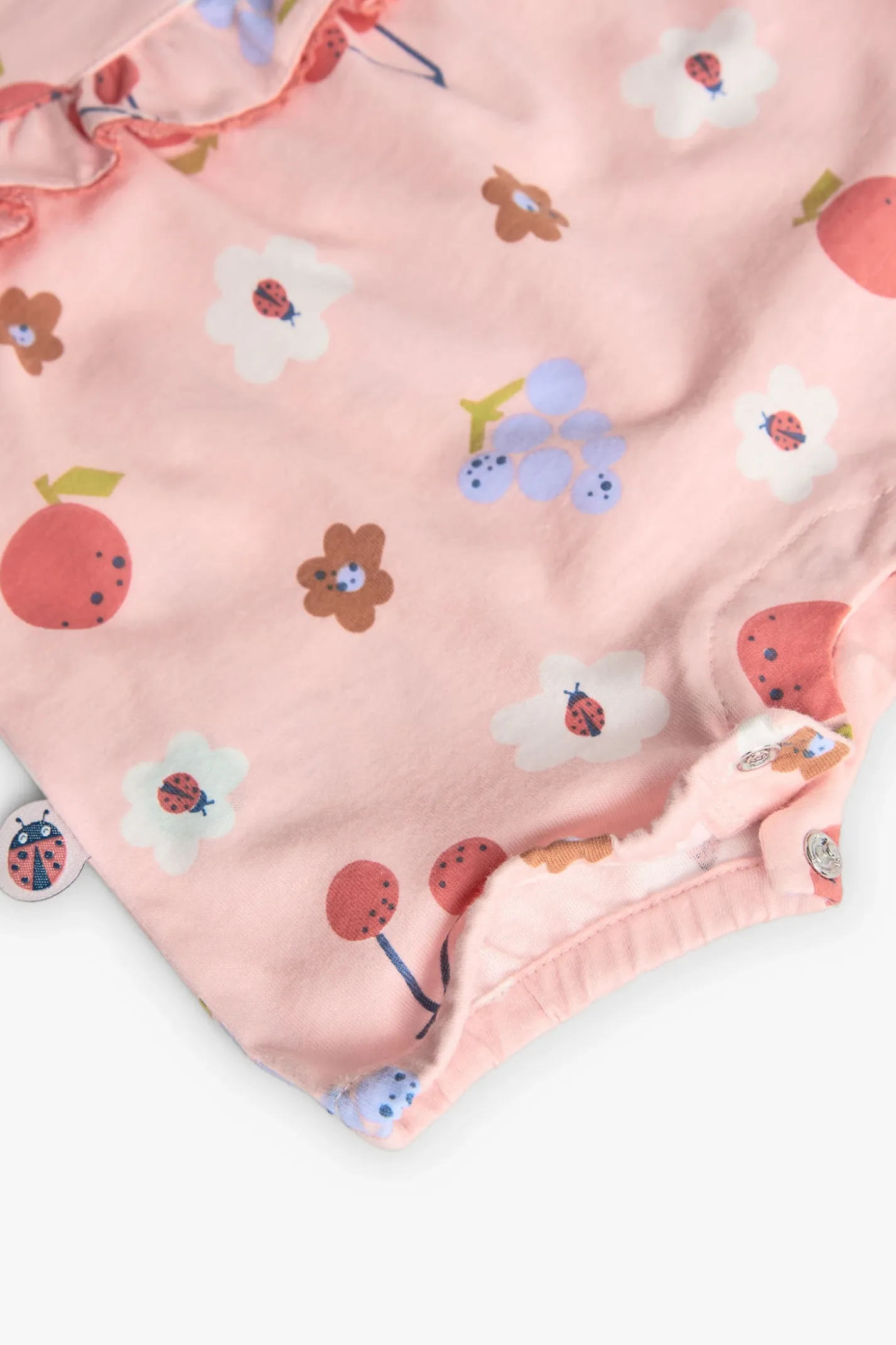Tutina in maglia per neonata con stampa floreale in rosa.