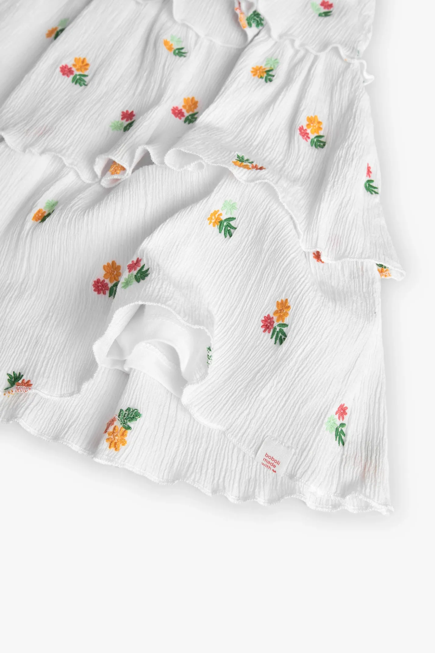 Vestito di bambula per bambina con design floreale in colore bianco